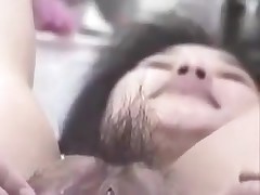 Korean bitch with large snatch and pouty lips receives wicked on camera. She stuffs her hirsute snatch with fingers, metal balls and even a bottle. This cunt can swallow a lot of semen too!